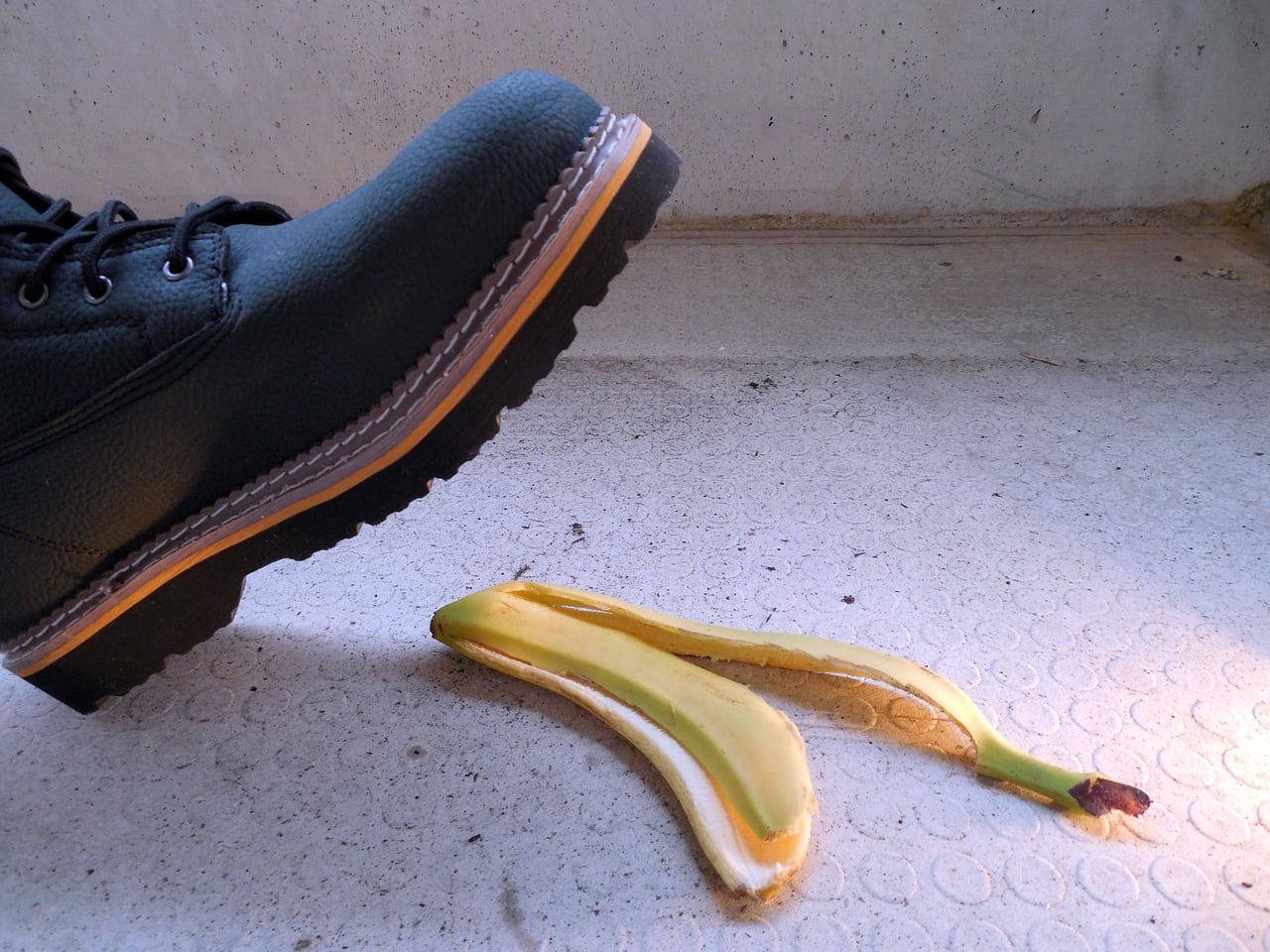 Foot and Banana Skin on the Floor