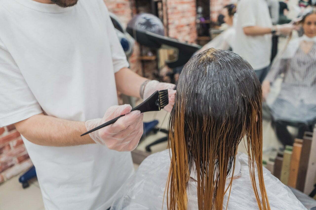 a person with a hair clipper